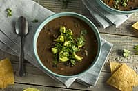 Fresh Homemade Black Bean Soup with Avocado and Cilantro