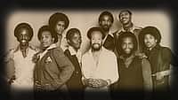 Earth, Wind, & Fire c. 1977. Front, from left: Verdine White, Al McKay, Philip Bailey, Maurice White, Andrew Woolfolk, Ralph Johnson. Back, from left: Larry Dunn, Fred White, Johnny Graham.